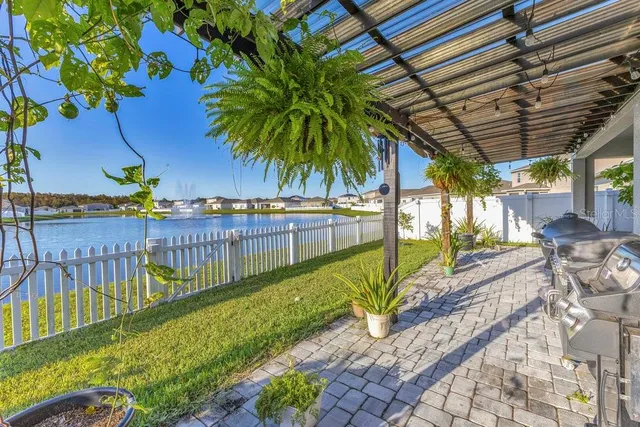 a view of a backyard with a patio