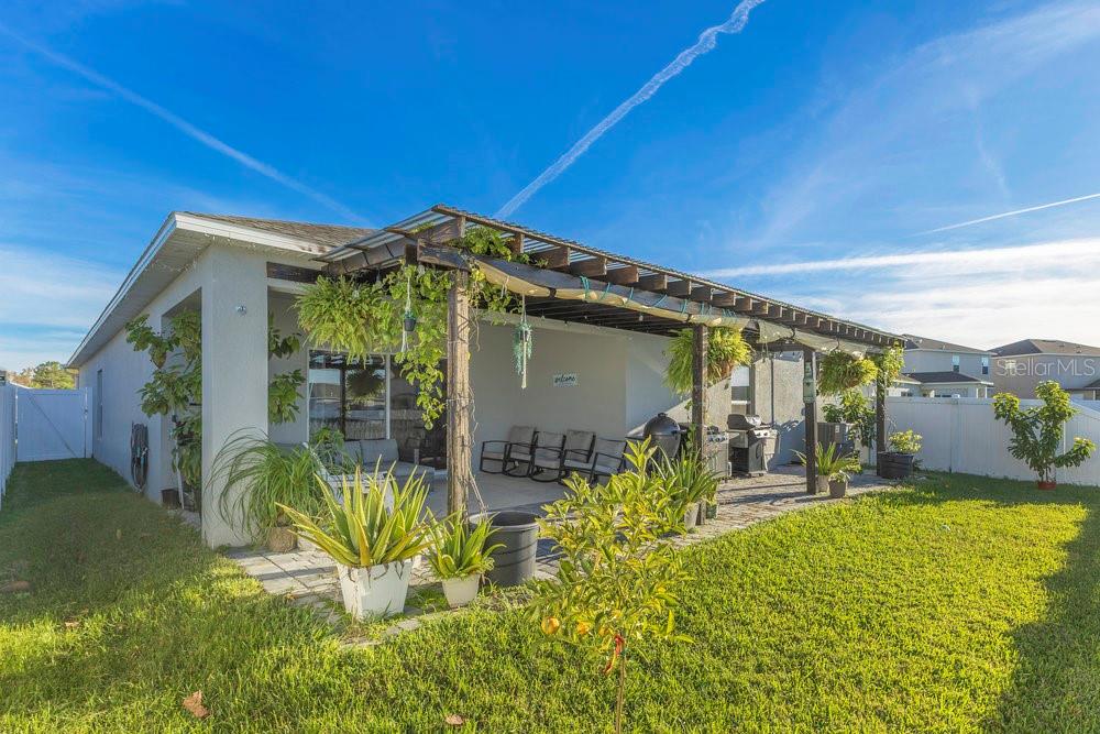 4255 Southern Vista Loop St. Cloud, FL 34772 - Photo 26 of 34 a front view of house with outdoor seating