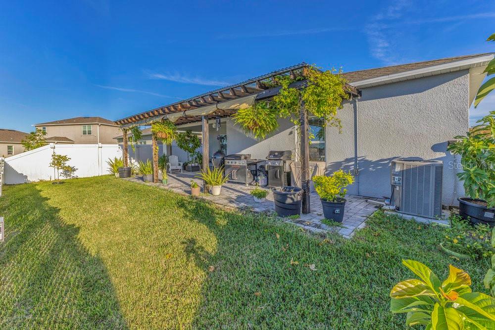 4255 Southern Vista Loop St. Cloud, FL 34772 - Photo 27 of 34 a house view with a garden space