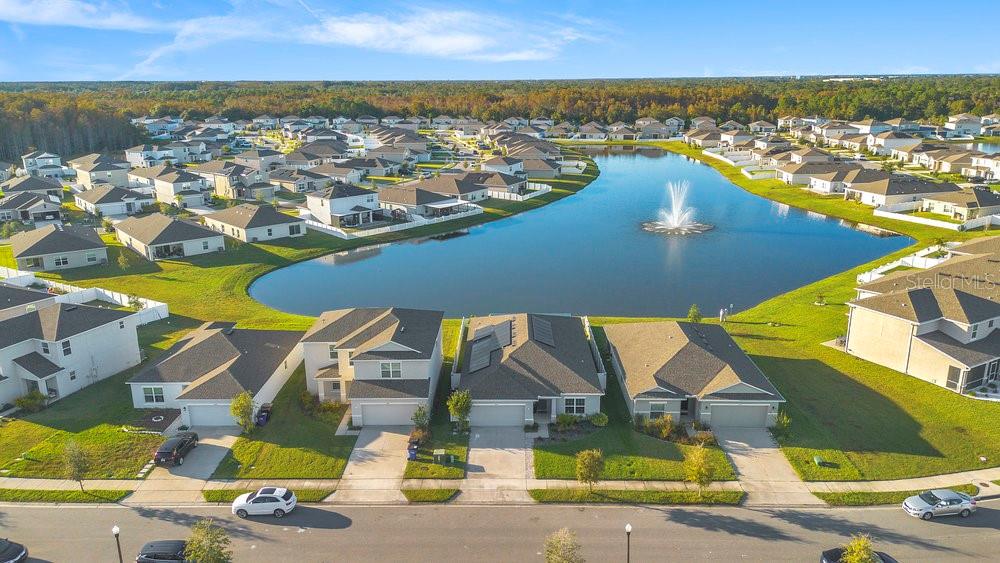 4255 Southern Vista Loop St. Cloud, FL 34772 - Photo 29 of 34 an aerial view of residential houses with outdoor space and ocean view