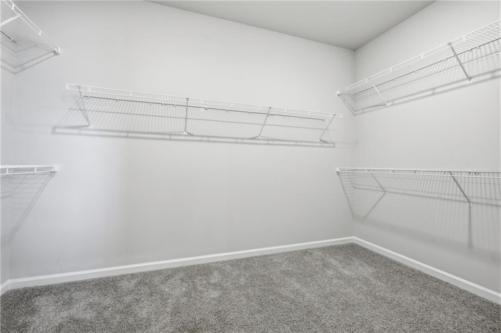 8820 Shipton Circle Ball Ground, GA 30107 - Photo 18 of 40 a view of a room with racks on the wall