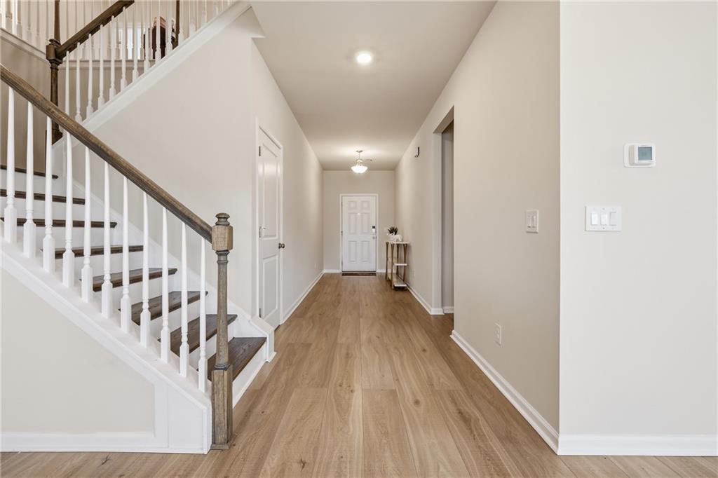 8820 Shipton Circle Ball Ground, GA 30107 - Photo 19 of 40 a view of entryway with wooden floor