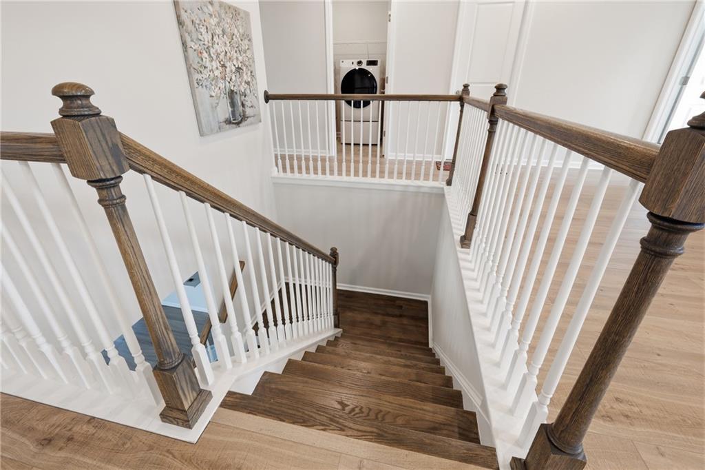 8820 Shipton Circle Ball Ground, GA 30107 - Photo 20 of 40 a view of staircase with railing and white walls
