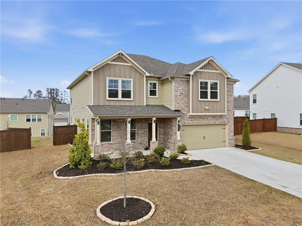 8820 Shipton Circle Ball Ground, GA 30107 - Photo 2 of 40 a front view of a house with entertaining space