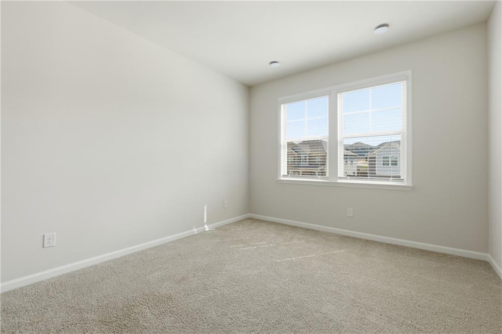 8820 Shipton Circle Ball Ground, GA 30107 - Photo 25 of 40 an empty room with a window