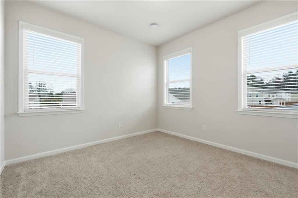 8820 Shipton Circle Ball Ground, GA 30107 - Photo 27 of 40 a view of an empty room with a window