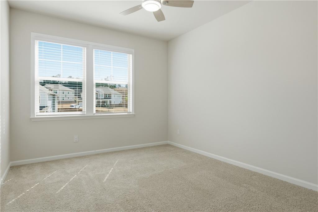 8820 Shipton Circle Ball Ground, GA 30107 - Photo 29 of 40 an empty room with a window