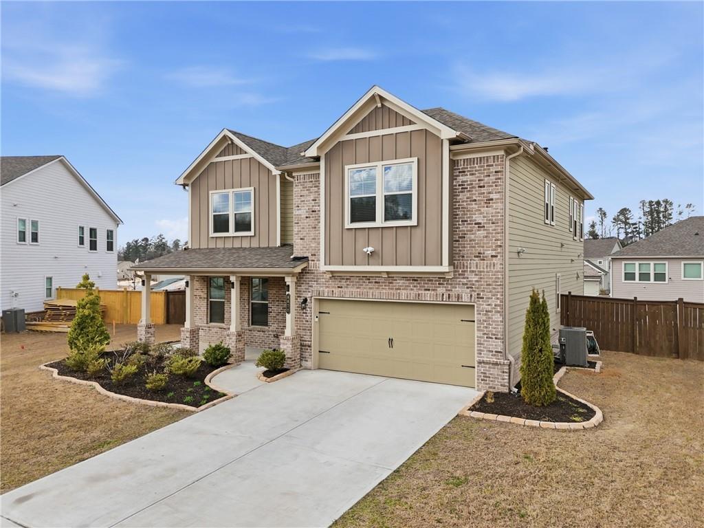 8820 Shipton Circle Ball Ground, GA 30107 - Photo 3 of 40 a front view of a house with entertaining space