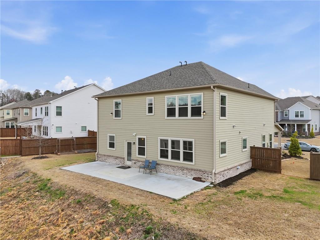 8820 Shipton Circle Ball Ground, GA 30107 - Photo 32 of 40 a front view of a house with a yard