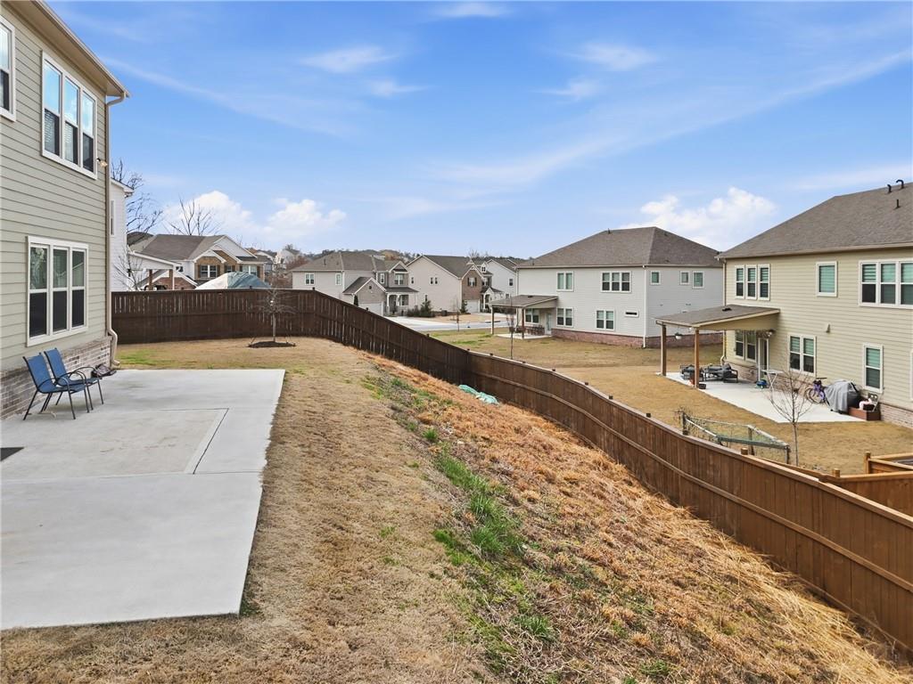 8820 Shipton Circle Ball Ground, GA 30107 - Photo 35 of 40 a view of a house with a yard