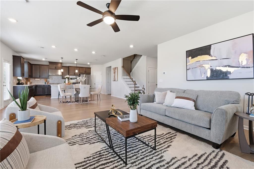 8820 Shipton Circle Ball Ground, GA 30107 - Photo 4 of 40 a living room with furniture and kitchen view