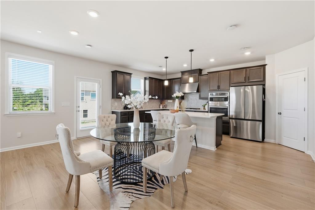 8820 Shipton Circle Ball Ground, GA 30107 - Photo 5 of 40 a view of kitchen with refrigerator a microwave and cabinets