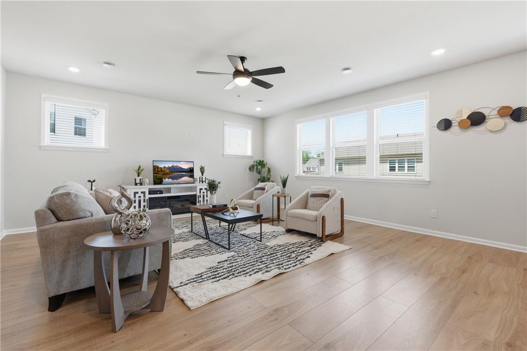 8820 Shipton Circle Ball Ground, GA 30107 - Photo 6 of 40 a living room with furniture and a window