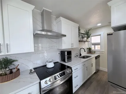a kitchen with a stove and cabinets