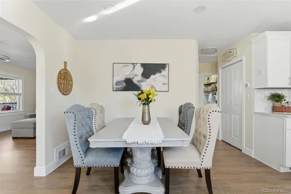 a kitchen with stainless steel appliances a refrigerator sink and cabinets