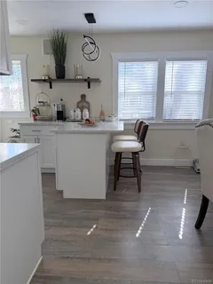 a kitchen with a sink cabinets and window