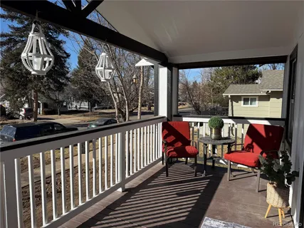 a view of a chairs and tables in the balcony