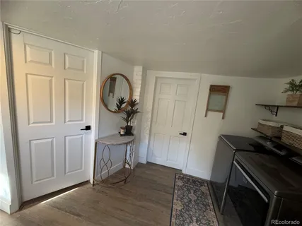 a view of a livingroom with furniture and wooden floor