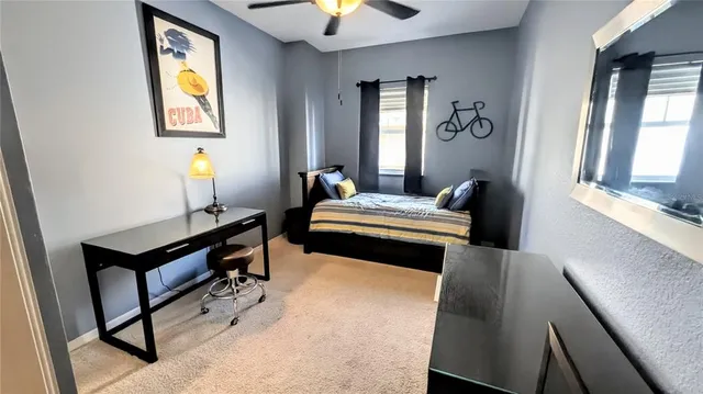 a bedroom with bed and window