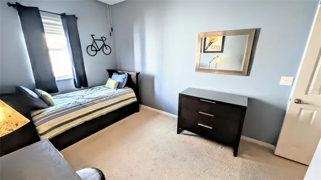 a bedroom with a bed and a fireplace