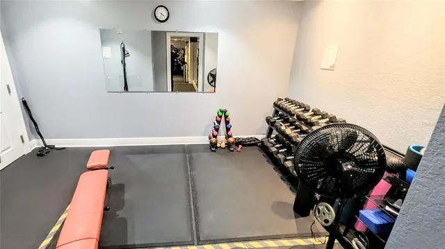 a room with furniture pool table and windows