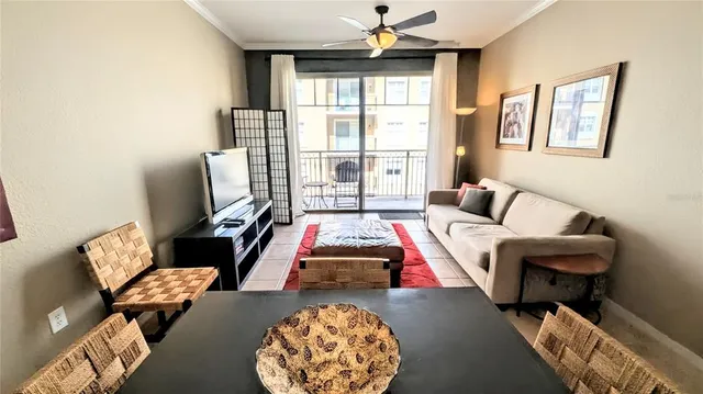 a living room with furniture and a large window