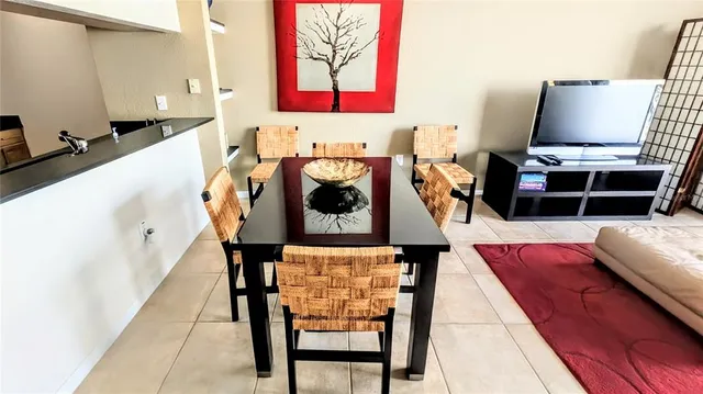 a living room with furniture and a rug