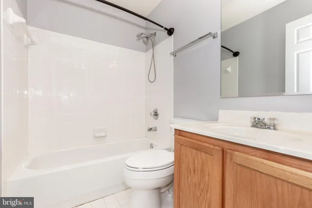 a bathroom with a sink a toilet and a bathtub