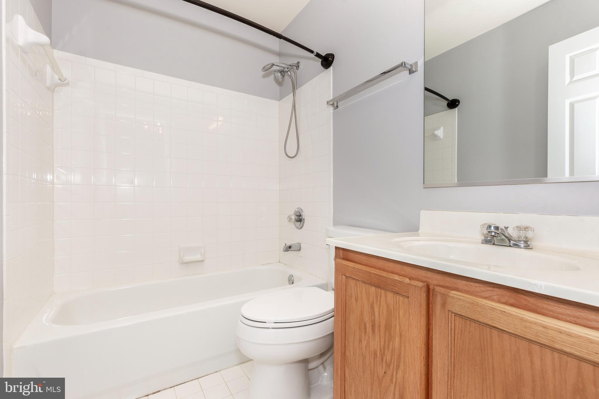 313-3 Sirens Court Odenton, MD 21113 - Photo 17 of 30 a bathroom with a sink a toilet and a bathtub