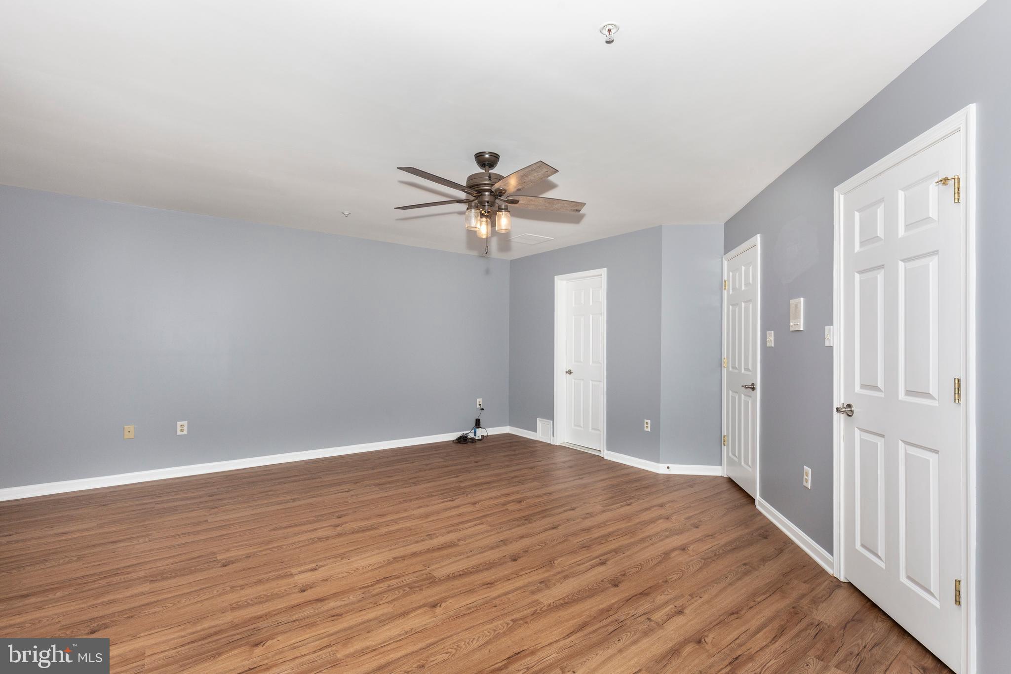 313-3 Sirens Court Odenton, MD 21113 - Photo 20 of 30 wooden floor in an empty room with a window