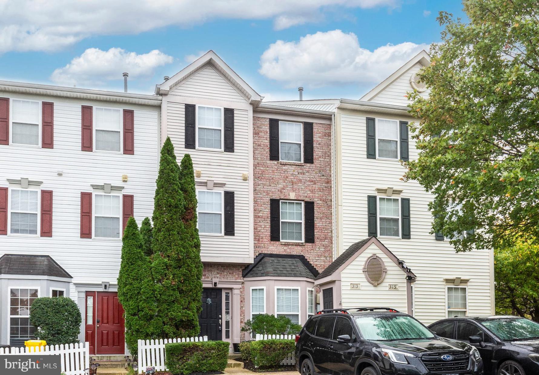 313-3 Sirens Court Odenton, MD 21113 - Photo 28 of 30 a front view of a house with cars parked