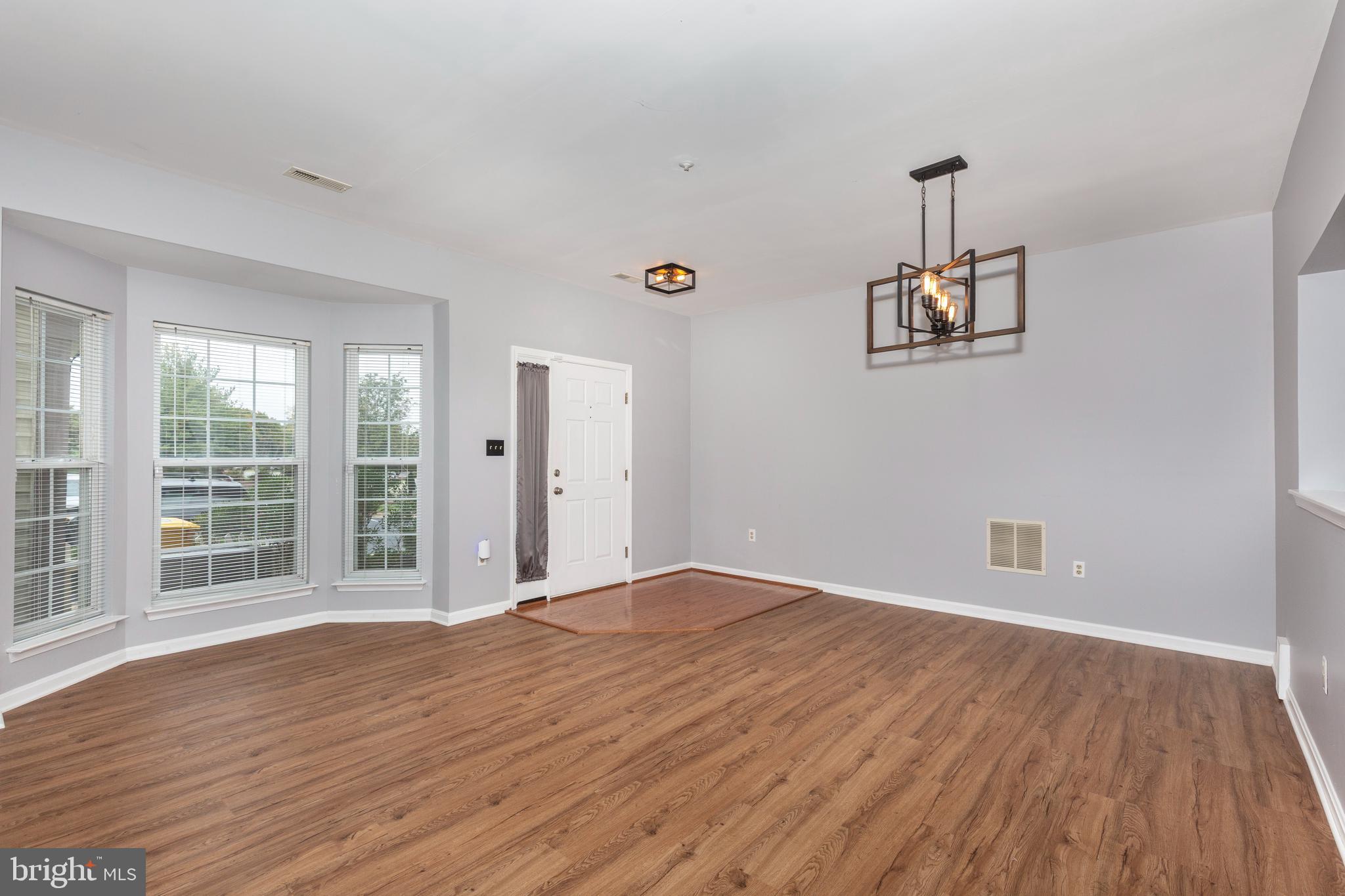 313-3 Sirens Court Odenton, MD 21113 - Photo 5 of 30 a view of a livingroom with wooden floor
