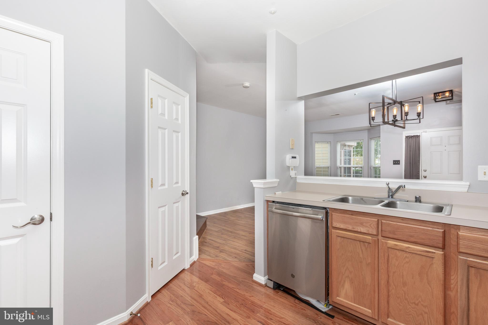 313-3 Sirens Court Odenton, MD 21113 - Photo 9 of 30 a bathroom with a double vanity sink and mirror