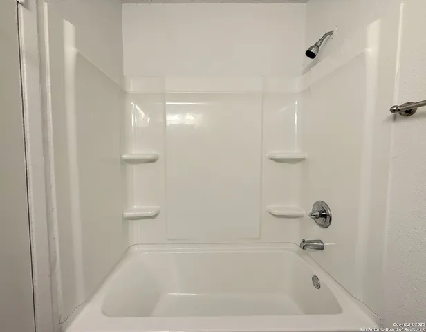 a close view of a bathtub in bathroom