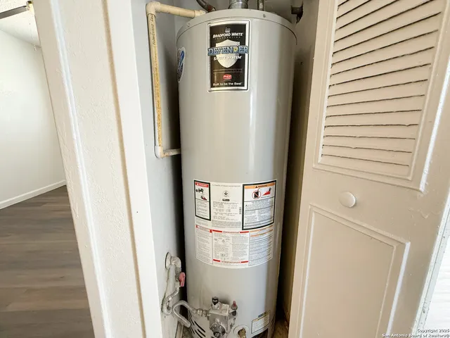 a view of an empty room and wooden floor