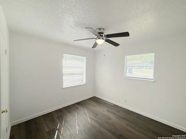 a view of room with wooden floor