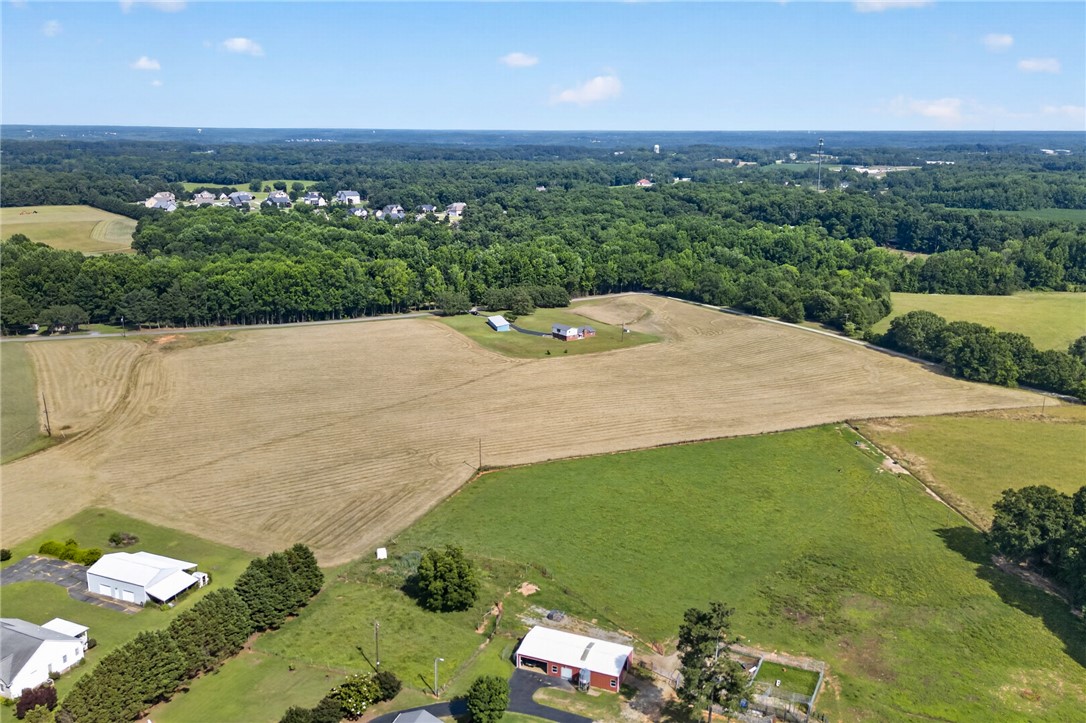 145 State Rd S-4-935 Pendleton, SC 29670 - Photo 35 of 47 Vast, open fields offer abundant space for agricultural pursuits or future development.