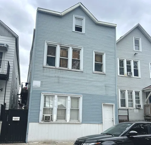 a view of a car parked in front of a building