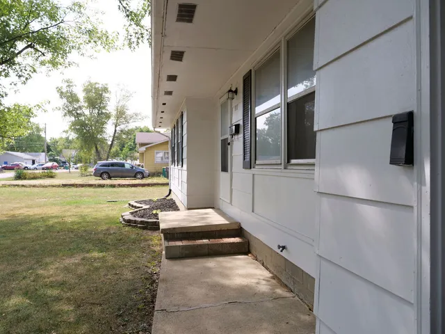 a view of a kitchen with a refrigerator