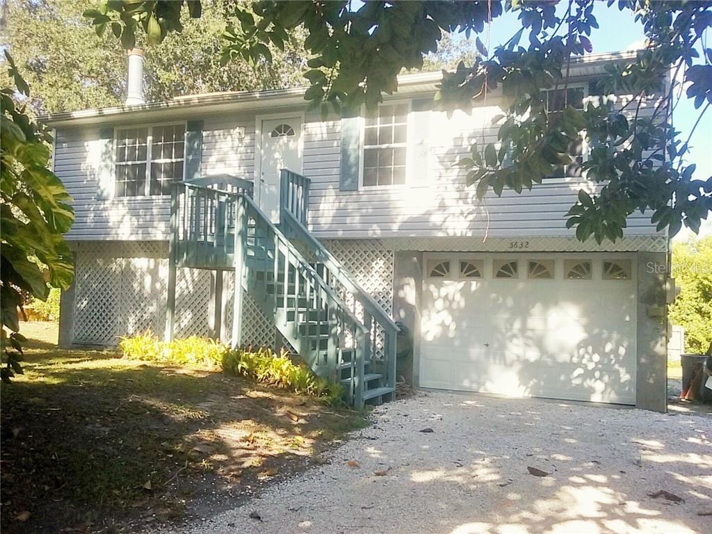 Living area is upstairs and downstairs is all garage/workshop areas.