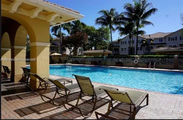 a view of a chairs and tables in the patio