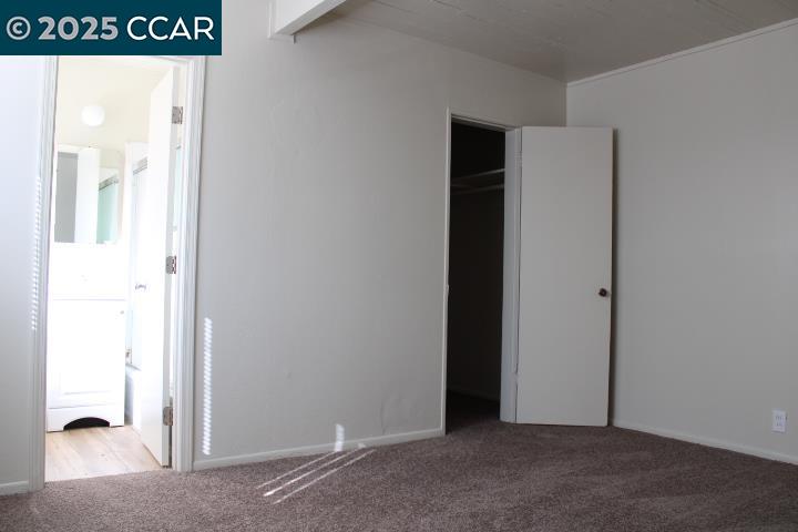 5103 Panama Avenue, Unit A Richmond, CA 94804 - Photo 6 of 10 a view of a room that has a large window