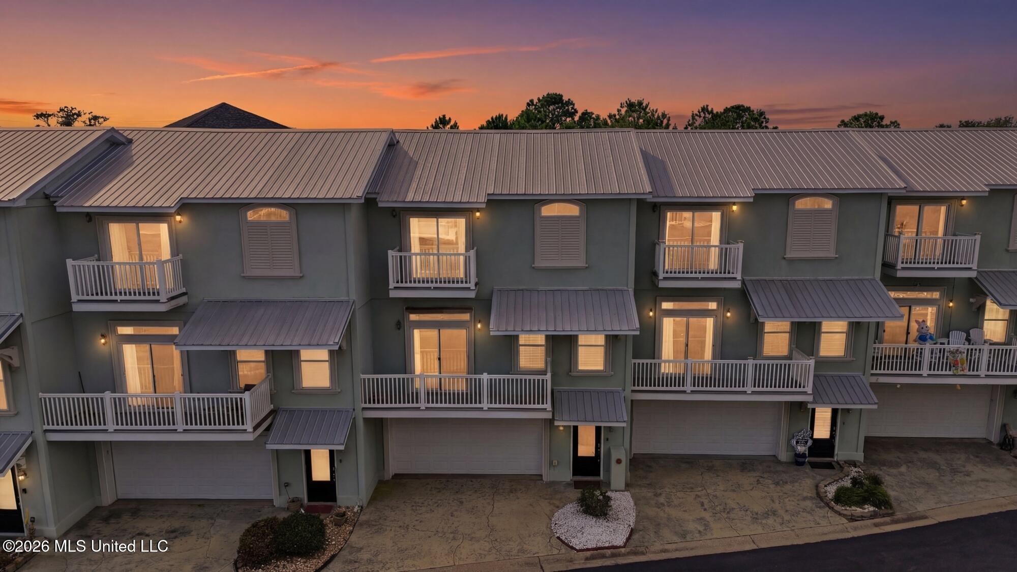 705 West Beach Boulevard, Unit 705 Long Beach, MS 39560 - Photo 34 of 35 3_dji_20250914211709_0124_d_twilight_5c4