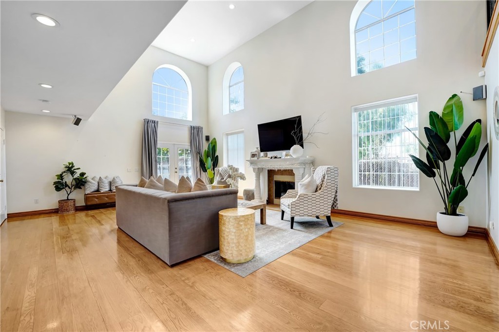 11242 Sheldon Street Sun Valley, CA 91352 - Photo 5 of 15 a living room with furniture a fireplace and a flat screen tv