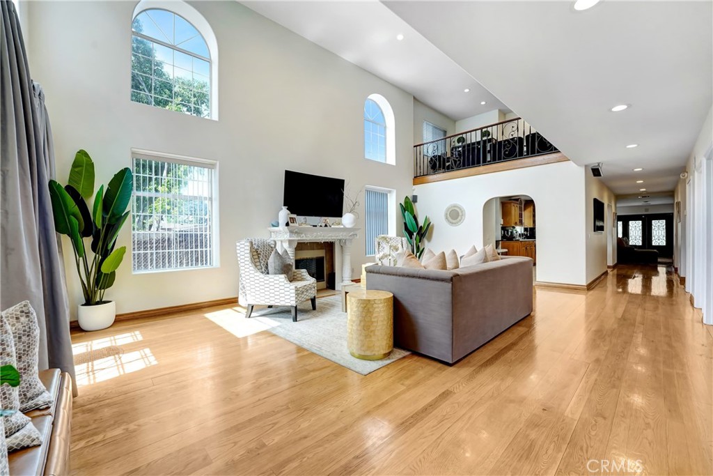 11242 Sheldon Street Sun Valley, CA 91352 - Photo 6 of 15 a living room with furniture a fireplace and a potted plant