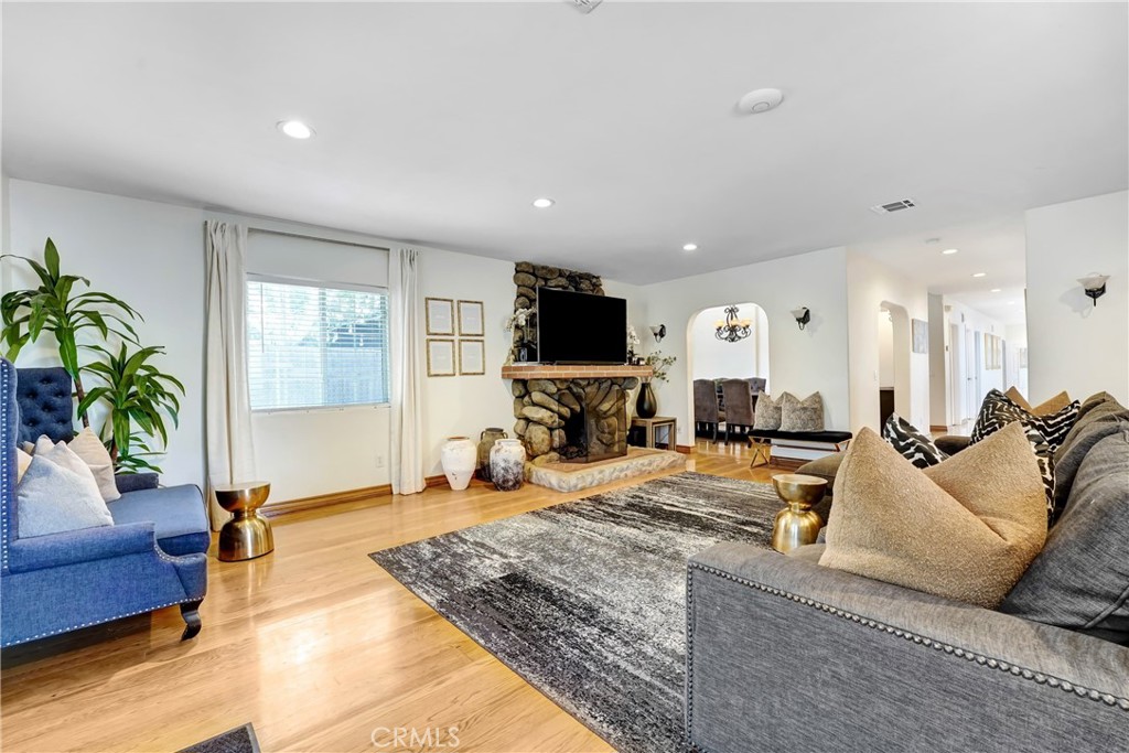 11242 Sheldon Street Sun Valley, CA 91352 - Photo 7 of 15 a living room with furniture and a flat screen tv