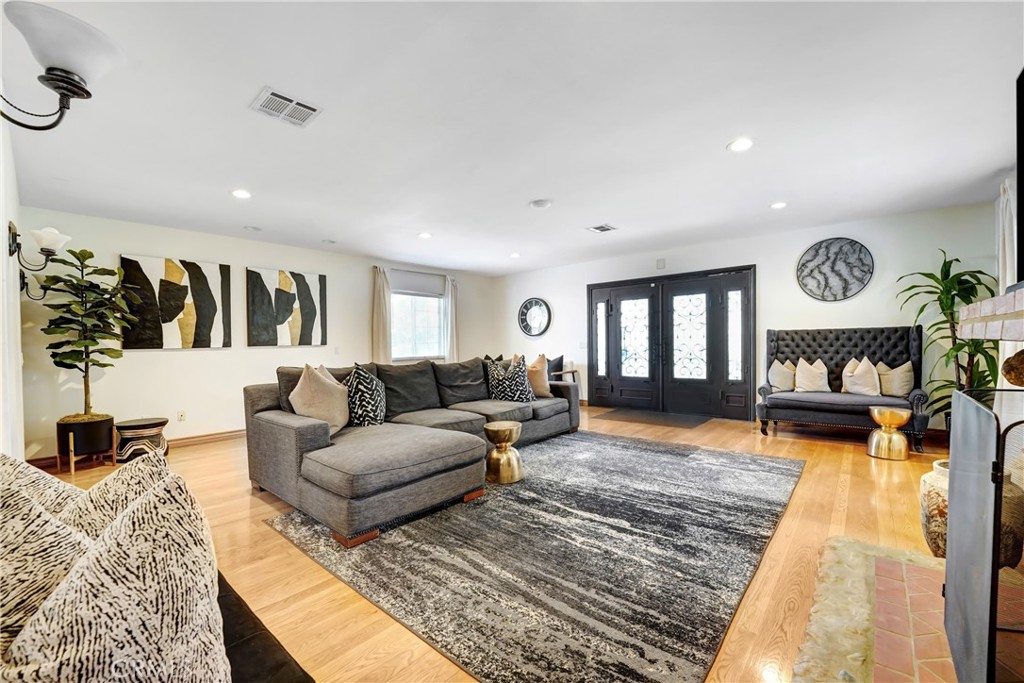 11242 Sheldon Street Sun Valley, CA 91352 - Photo 8 of 15 a living room with furniture window and a fireplace