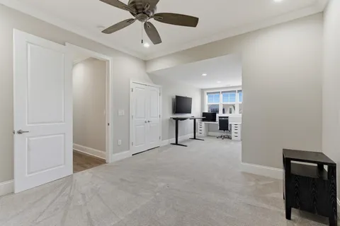 a bedroom with furniture and a window