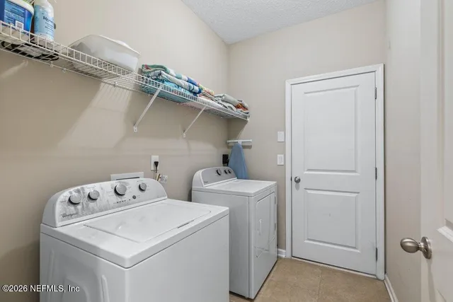 a living room with furniture windows and a flat screen tv