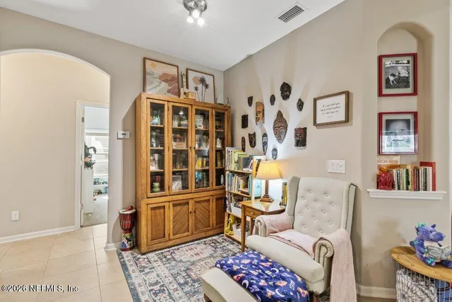 a spacious bathroom with a bathtub sink and a mirror